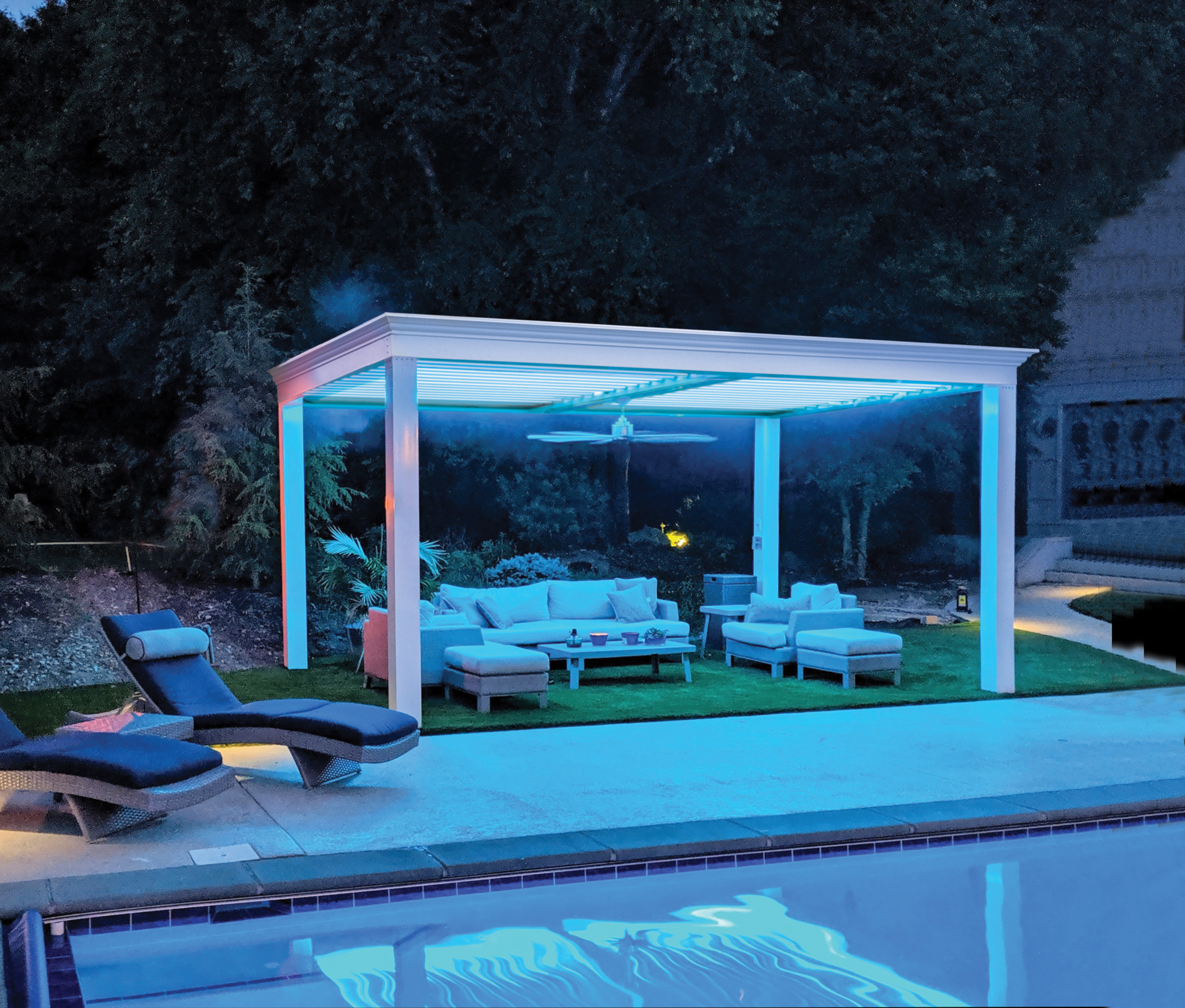 Modern Pergola in backyard seating area. Has a white post and white louvers.