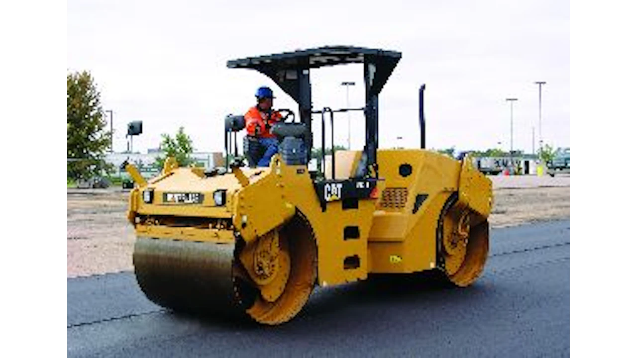 Asphalt paving with vibratory rollers to achieve proper compaction