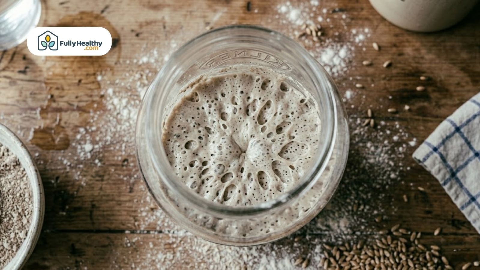 Close-up of bubbly sourdough starter showing fermentation bubbles during the process of how to make sourdough starter.