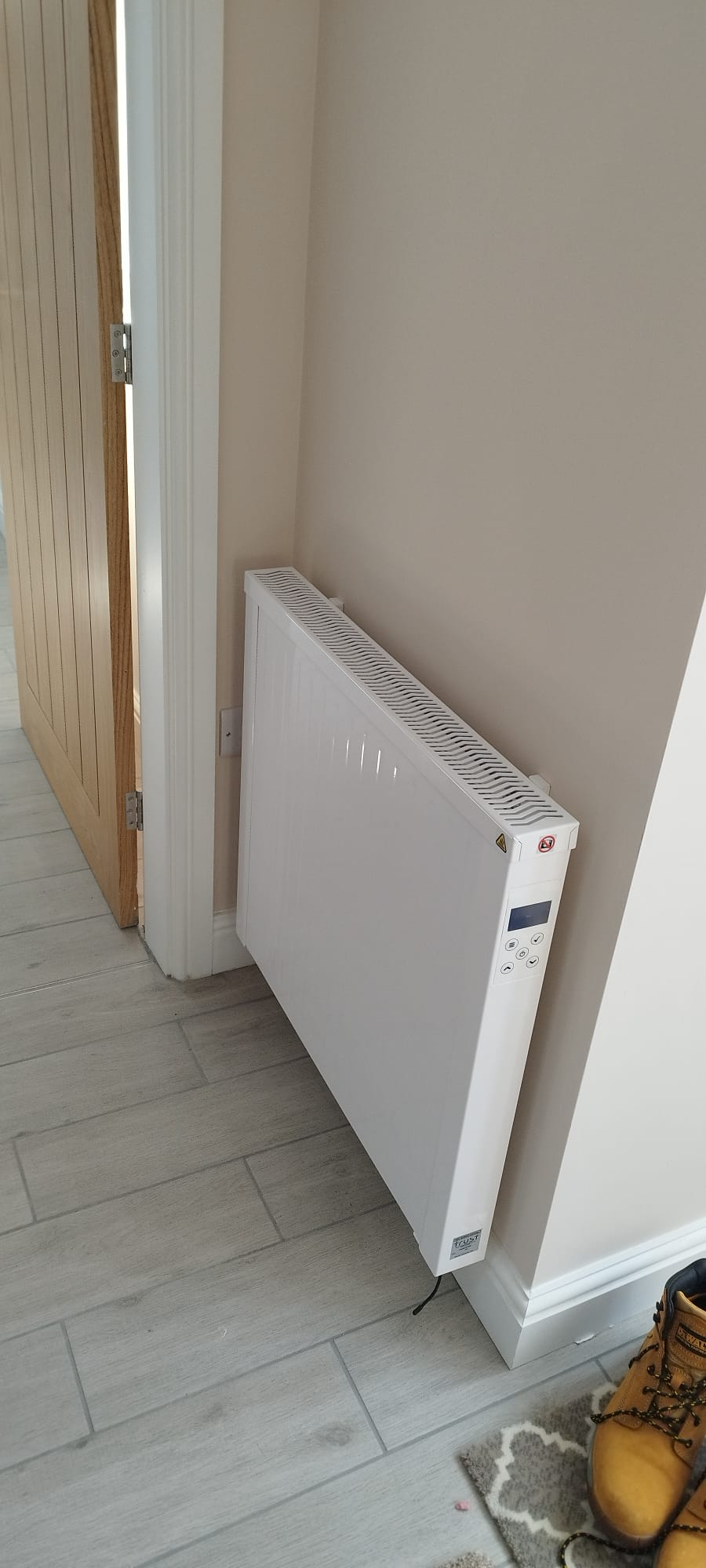 An infrared heating panel installed in a home, providing heat