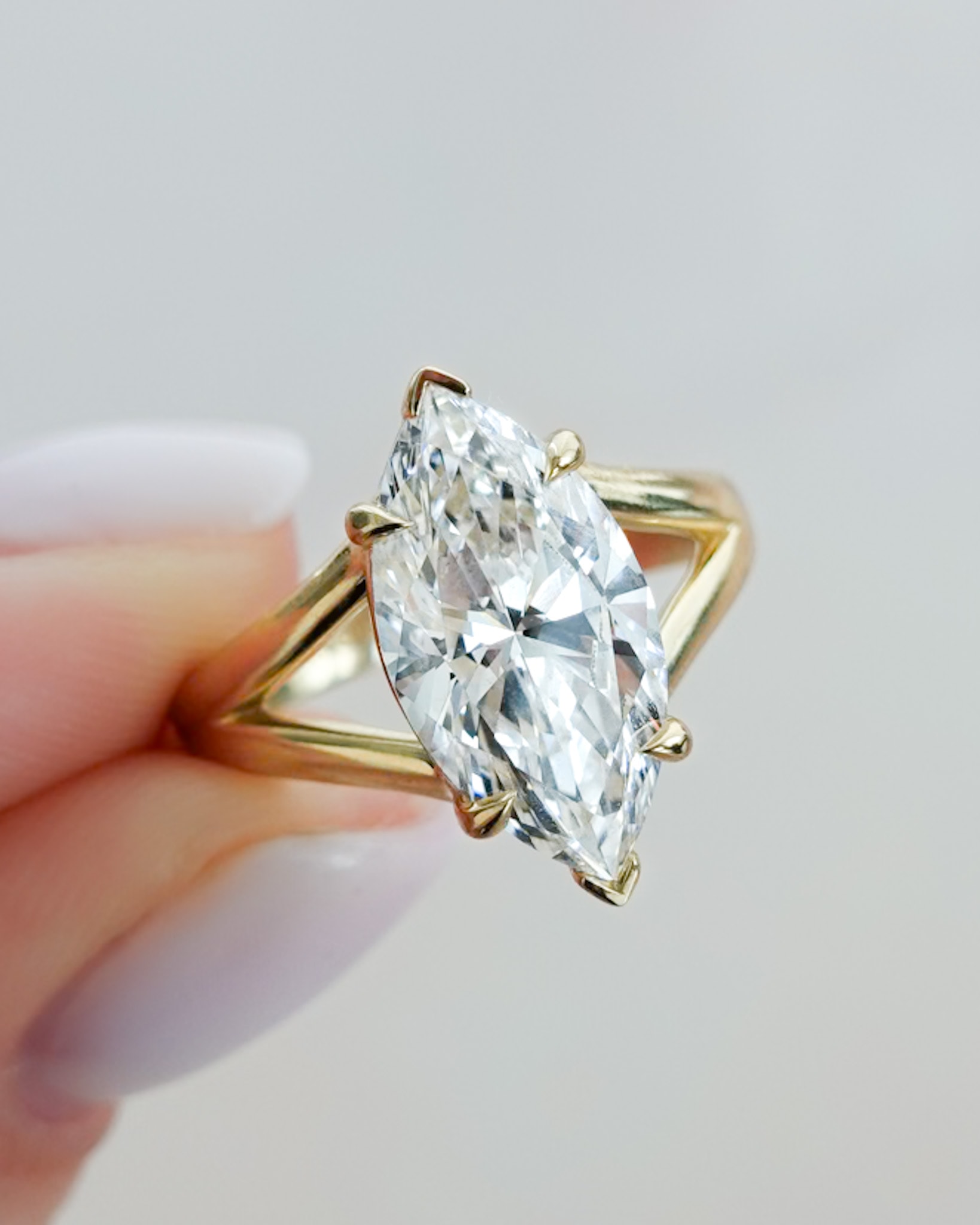 GOODSTONE Split Shank Solitaire Engagement Ring with Marquise Cut Diamond