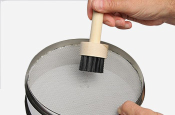 Sieve cleaning process with warm water and detergent