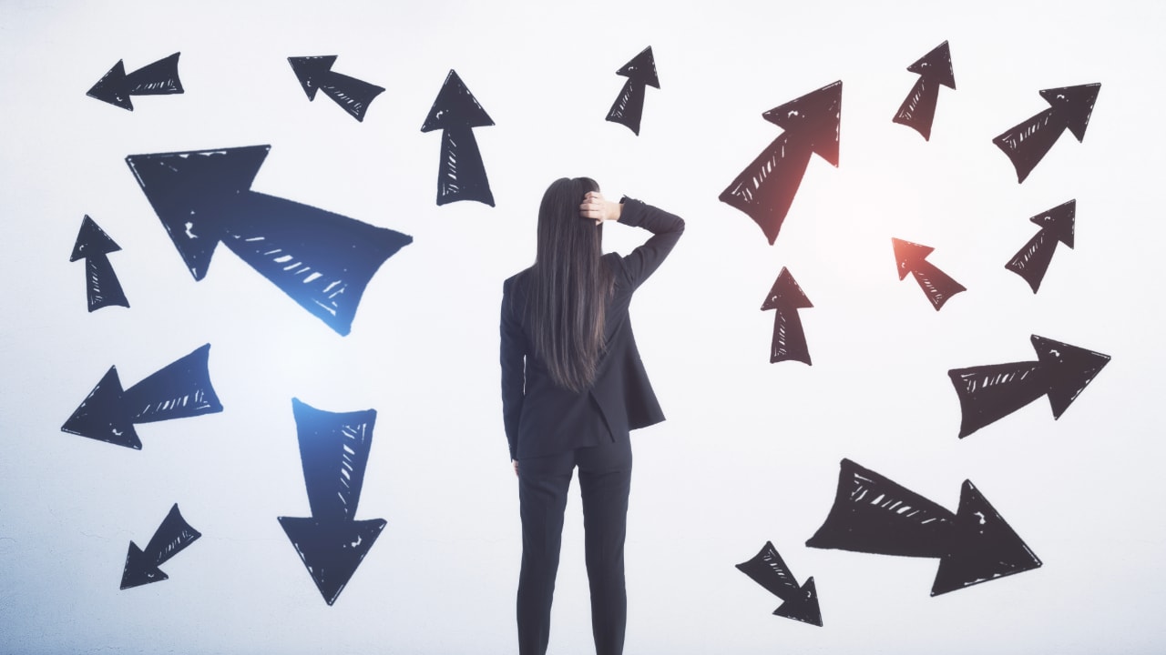 woman looking at multiple arrowed choices