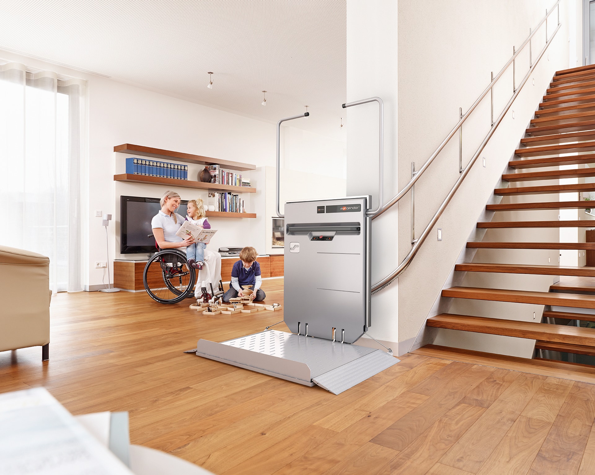 An inclined stair lift installed on a staircase.