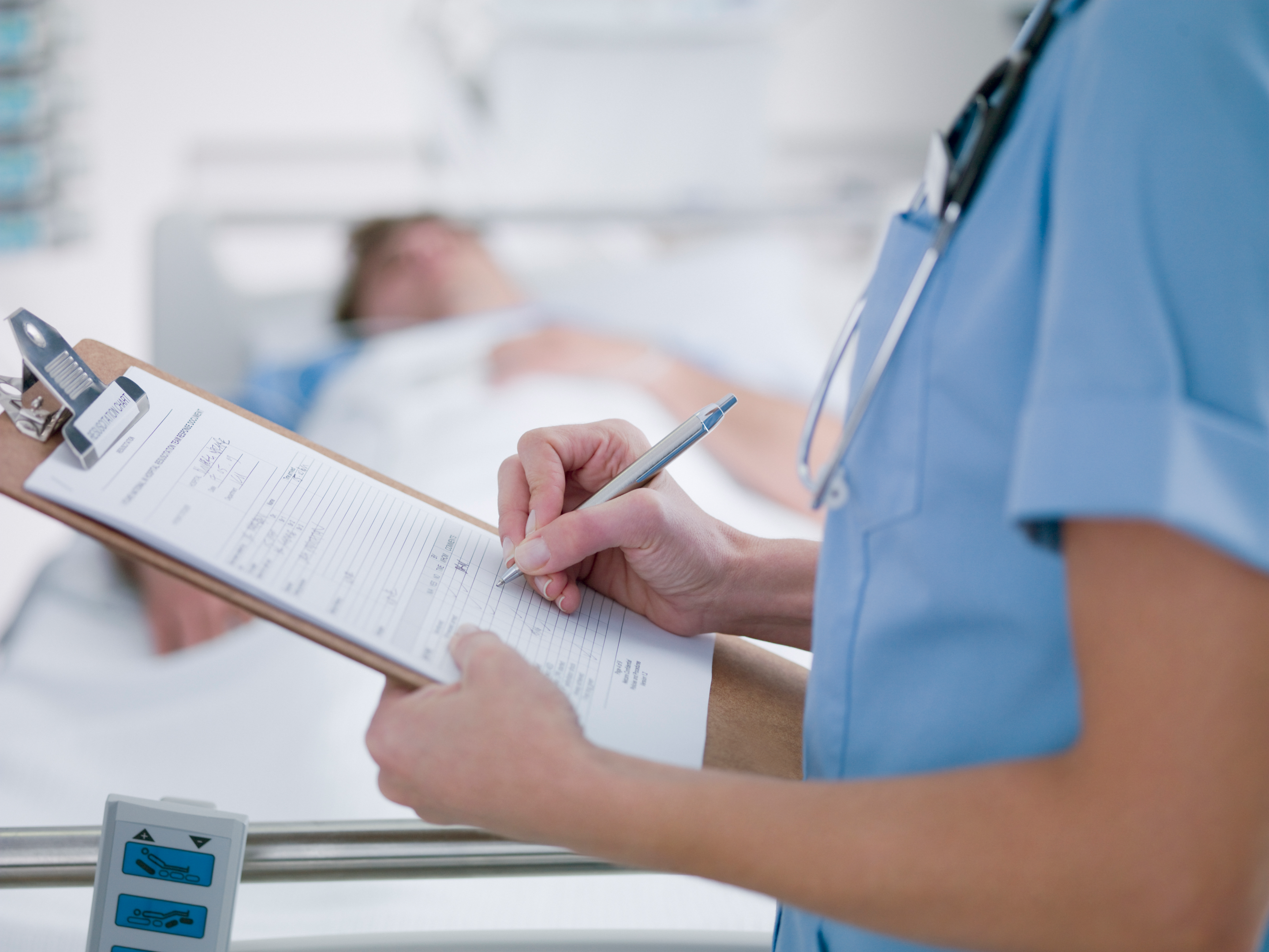 nurse-writing-on-clipboard