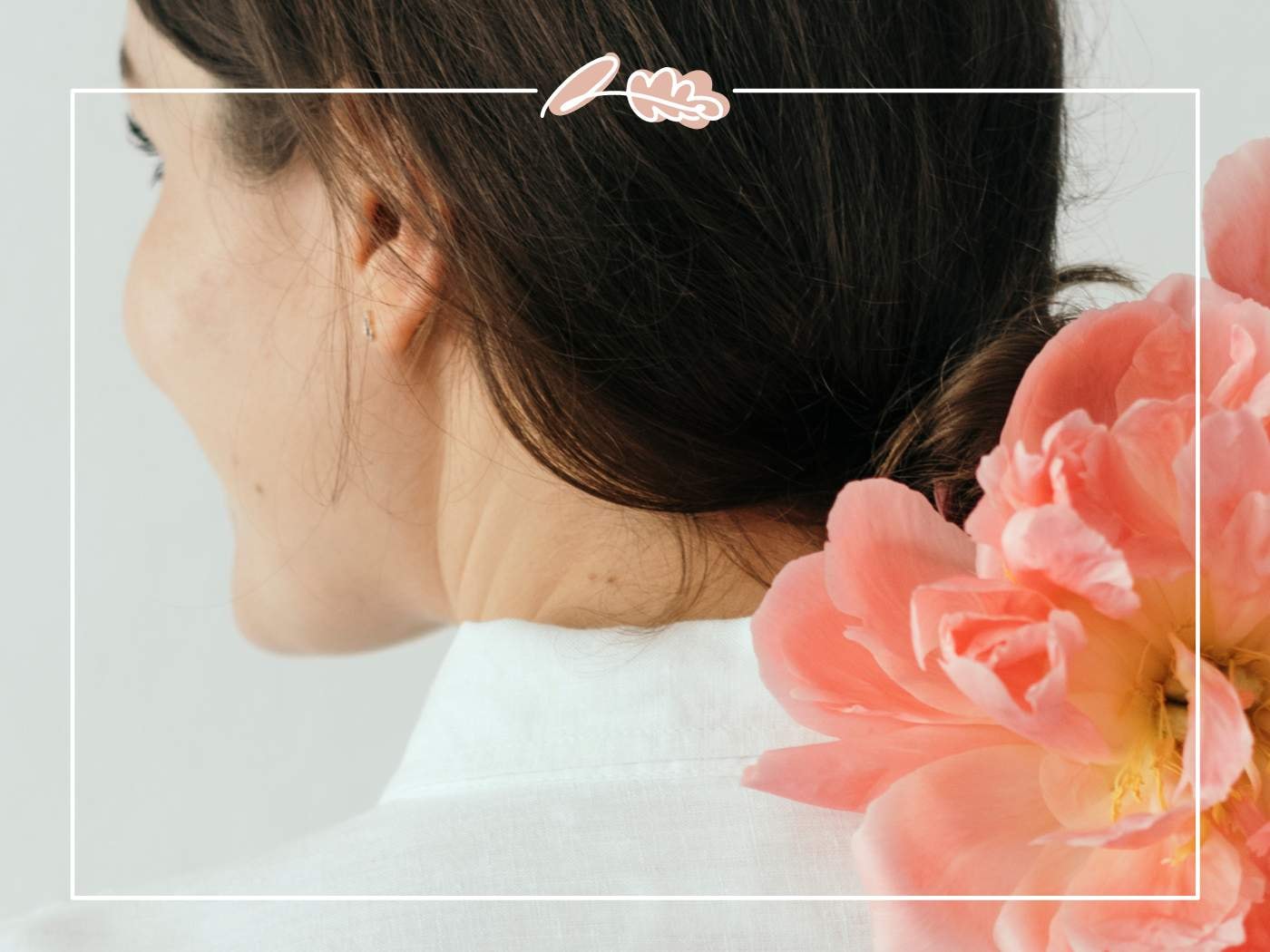 A woman with a soft pink peony in her hair, showcasing the beauty of peonies in '11 Fabulous Reasons to Buy Peonies'.