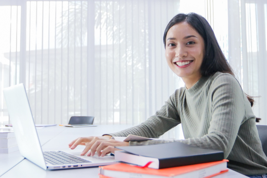 Filipina remote worker submitting job application and resume