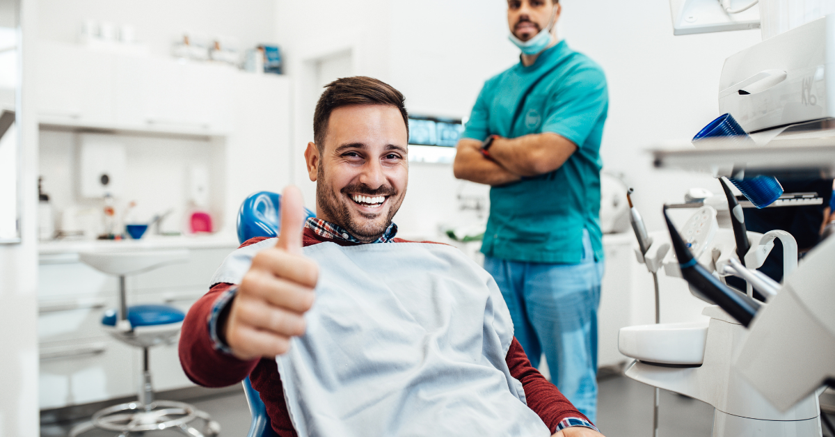 A happy dental patient that is ready to provide a 5-star review.