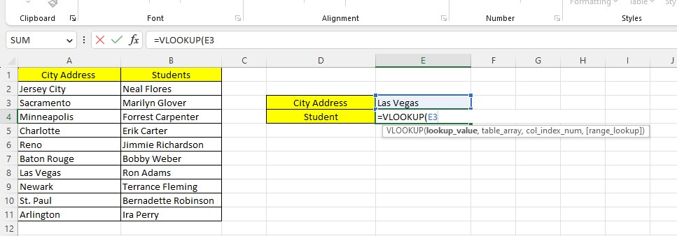 Type the VLOOKUP function and the lookup value.
