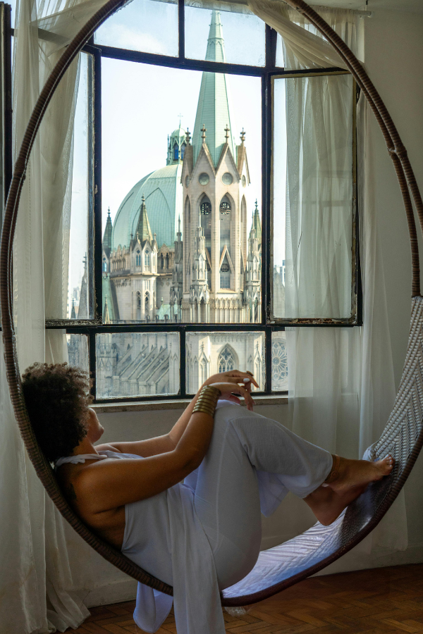 a woman sitting in a window seat