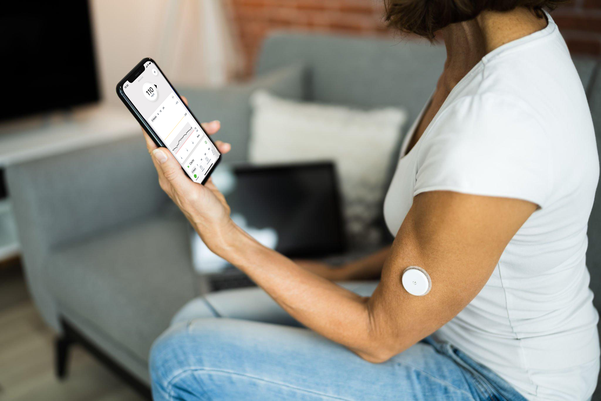 A person receiving an alert of several sequential readings on their phone for their real time glucose readings