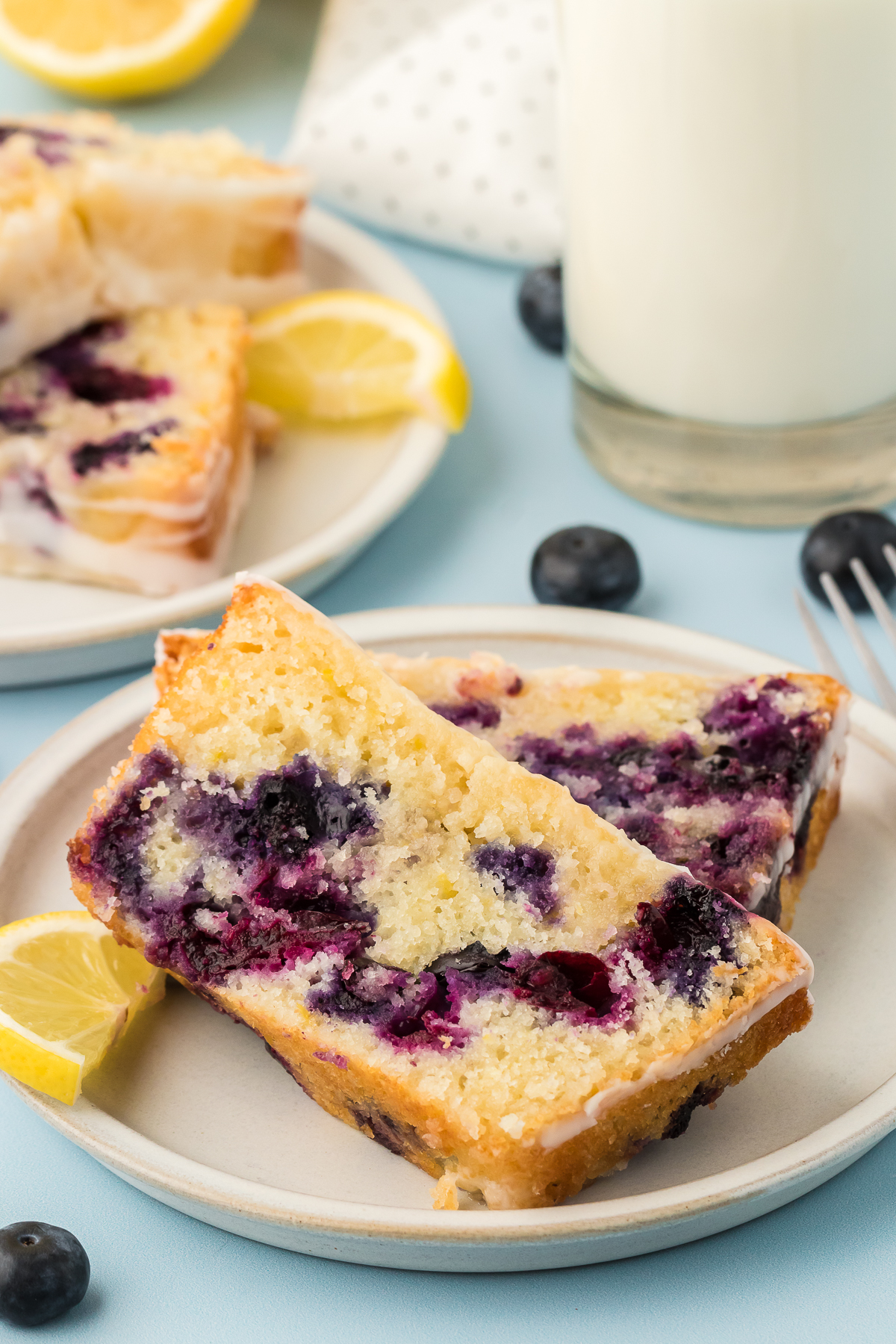 two slices of blueberry lemon bread on a plate