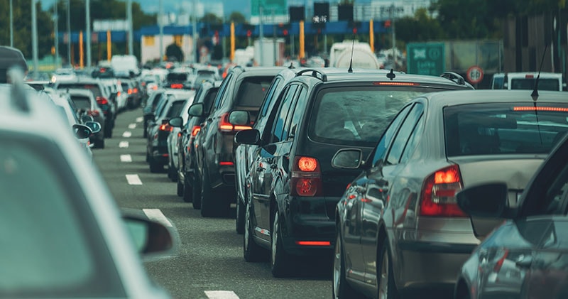 A traffic jam, symbolizing the chaos and constant rush of modern culture.