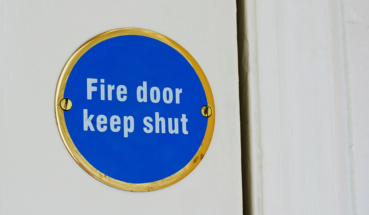 Fire doors - fire door keep shut sign - fire door regulations - fire resistance - fire protection 