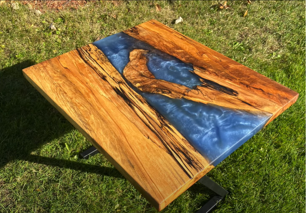 An epoxy river end table made by JD Woodworking.