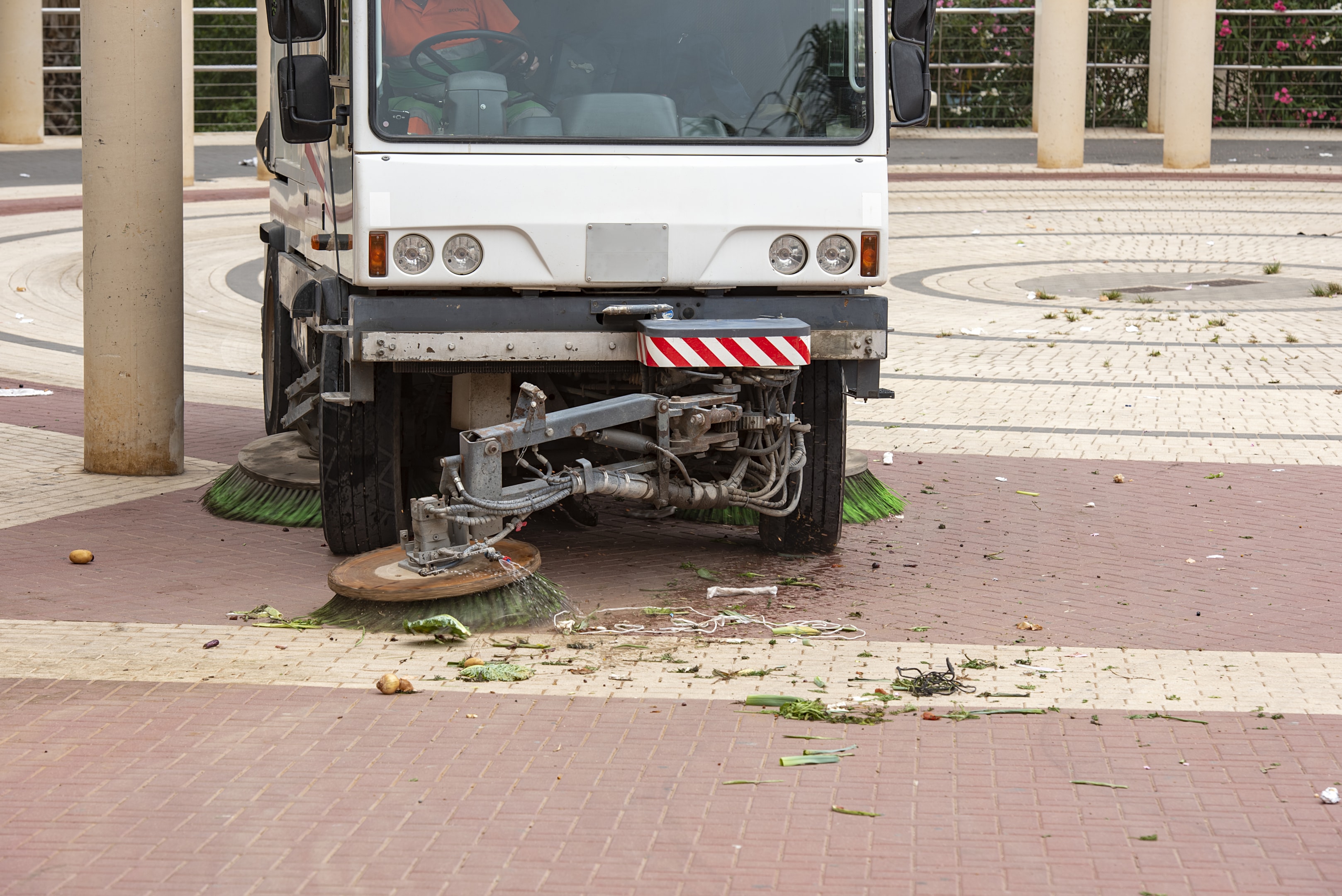 A parking lot being swept to showcase environmental benefits.