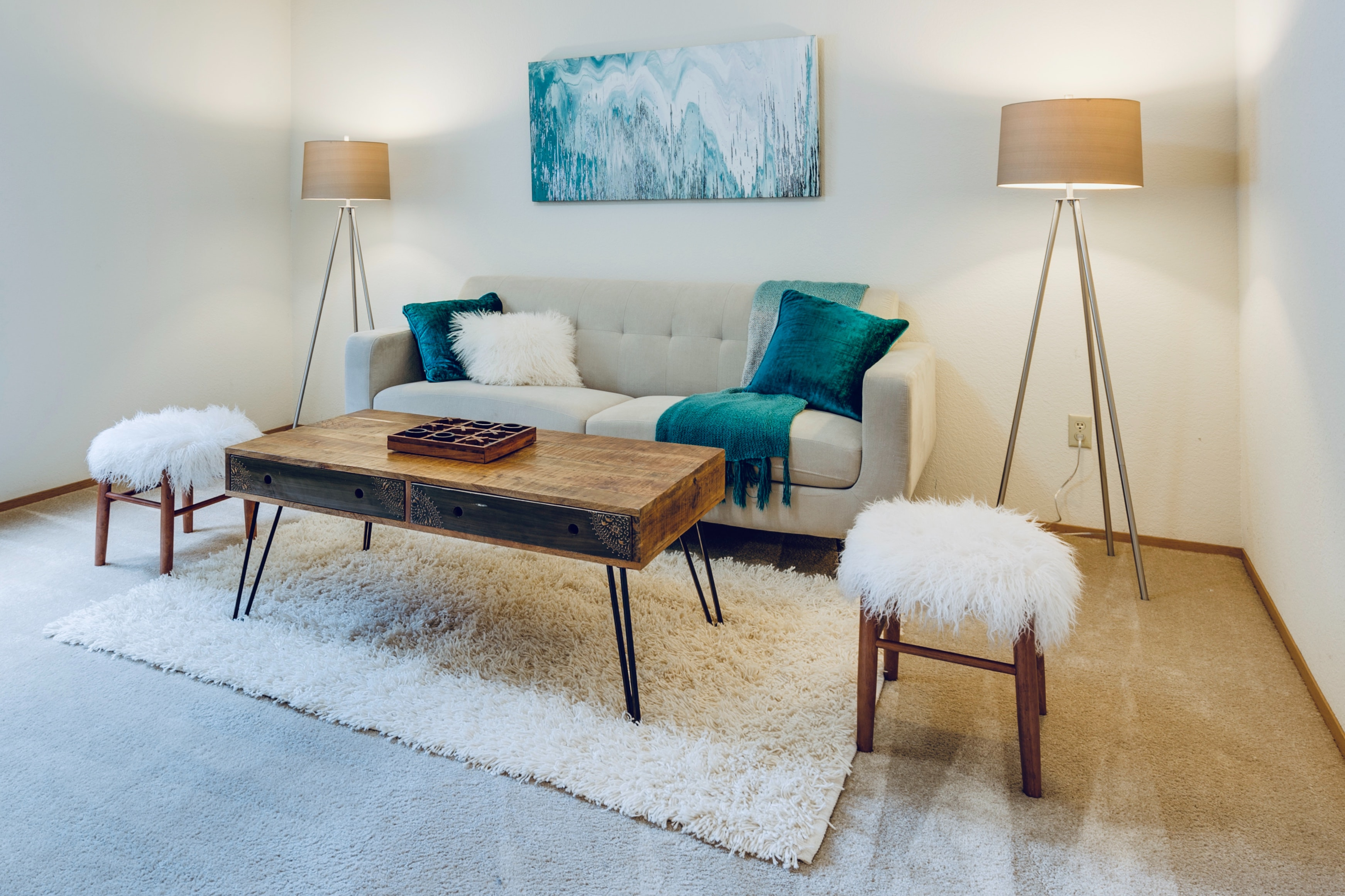 A modern living room with dark recesses well-lit