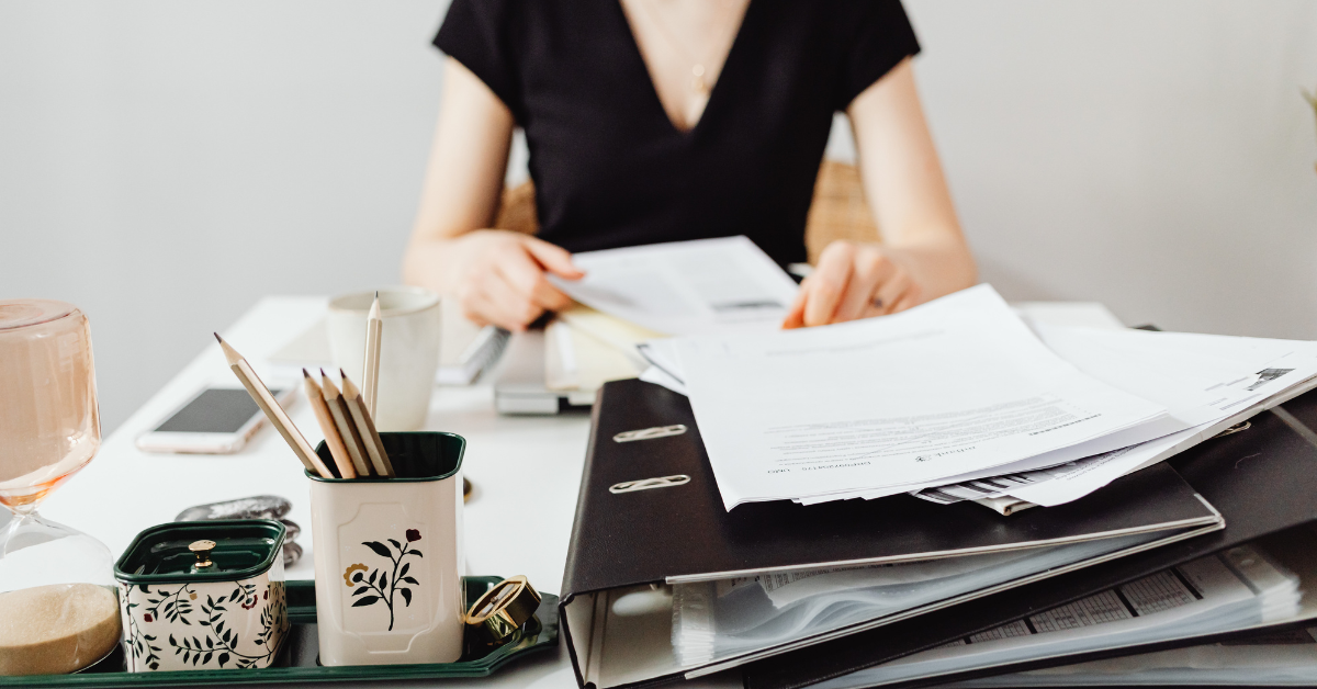Woman reading Form 1120-F instructions for her foreign corporation tax filing.