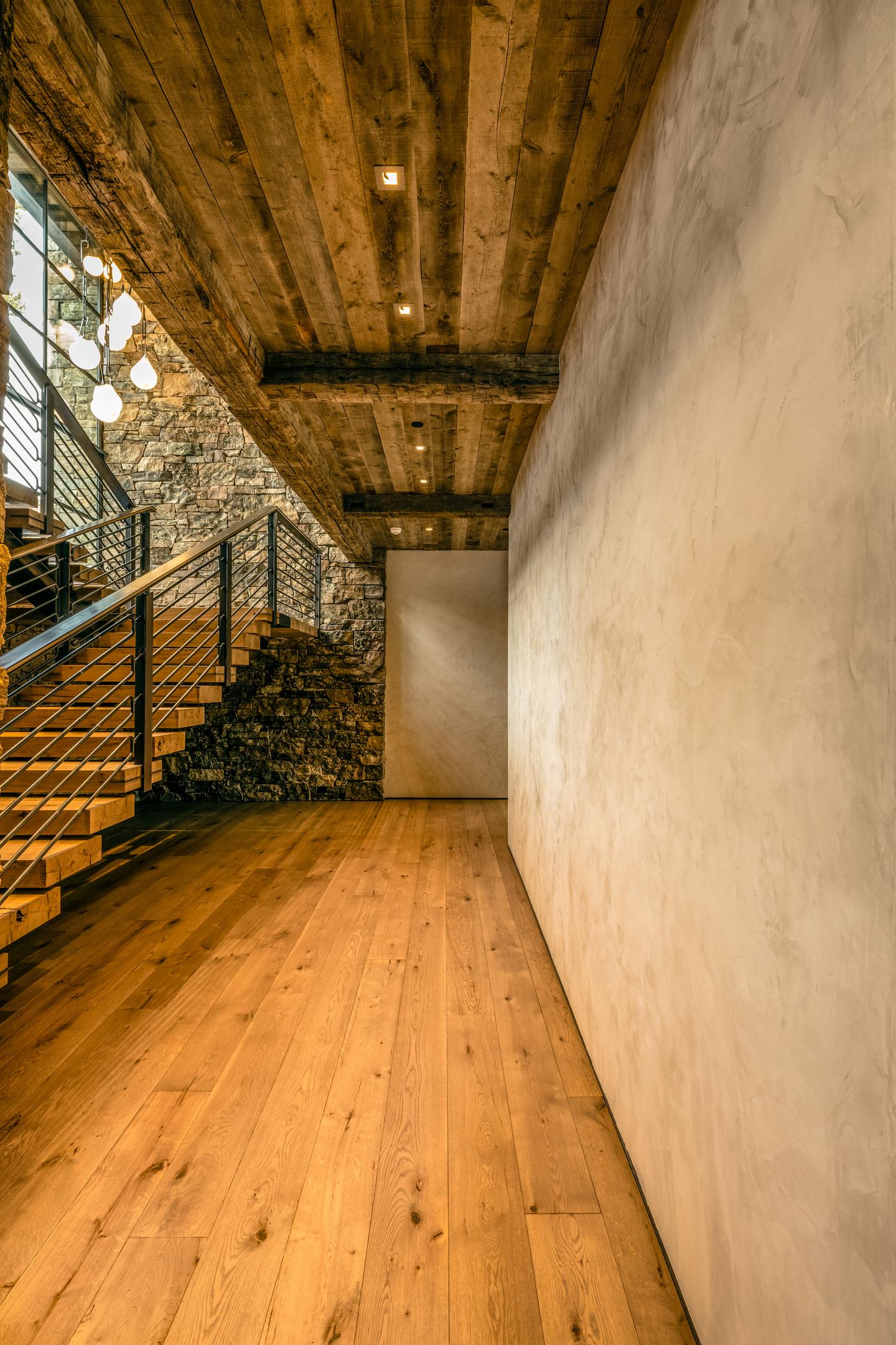 This image showcases a smooth beige plaster texture, highlighting the intricate trowel movement. The subtle color variation adds depth and warmth, embodying the elegance and durability of this natural material, perfect for enhancing rustic interiors.