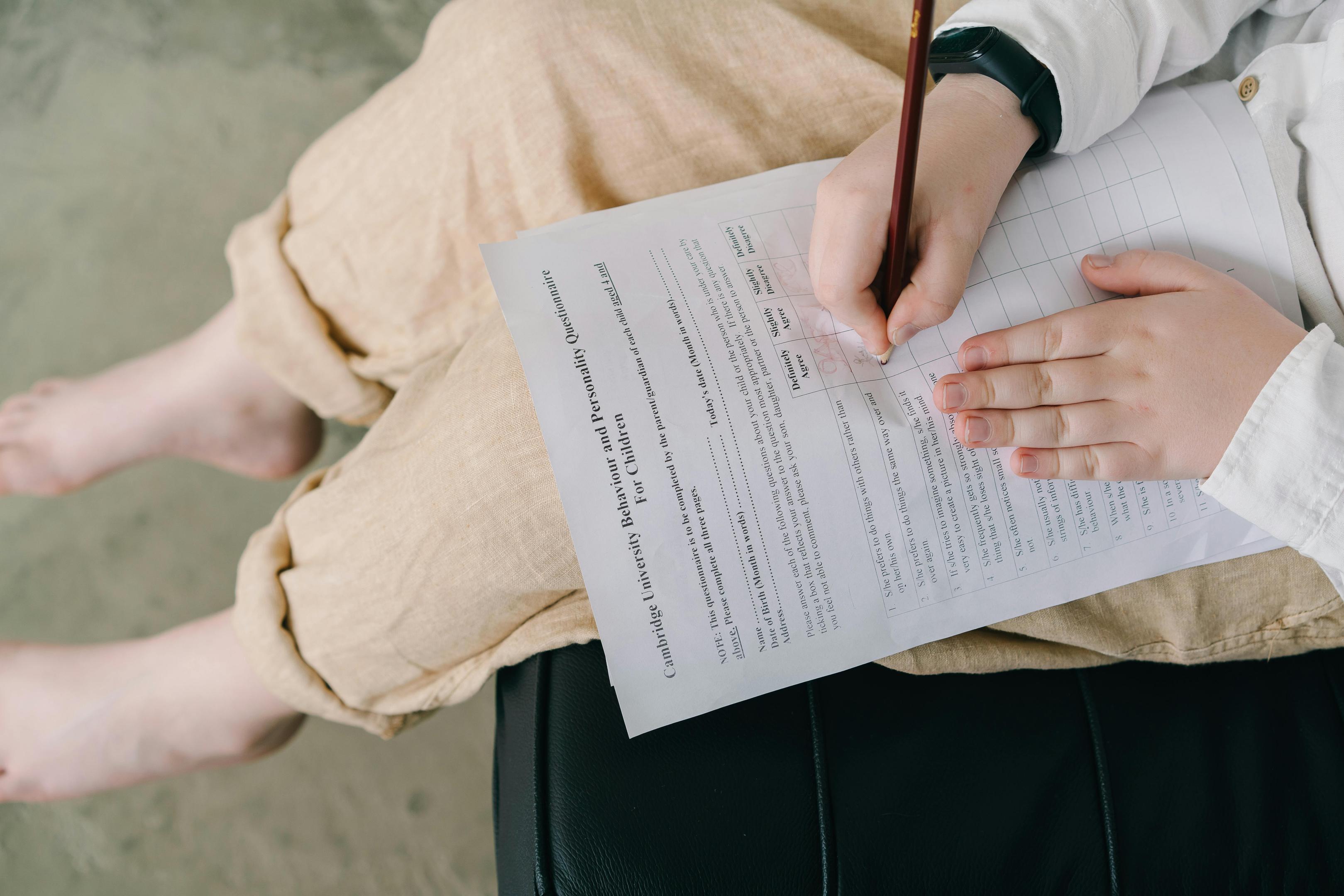 Child fills out a quesionairre as part of psychological testing