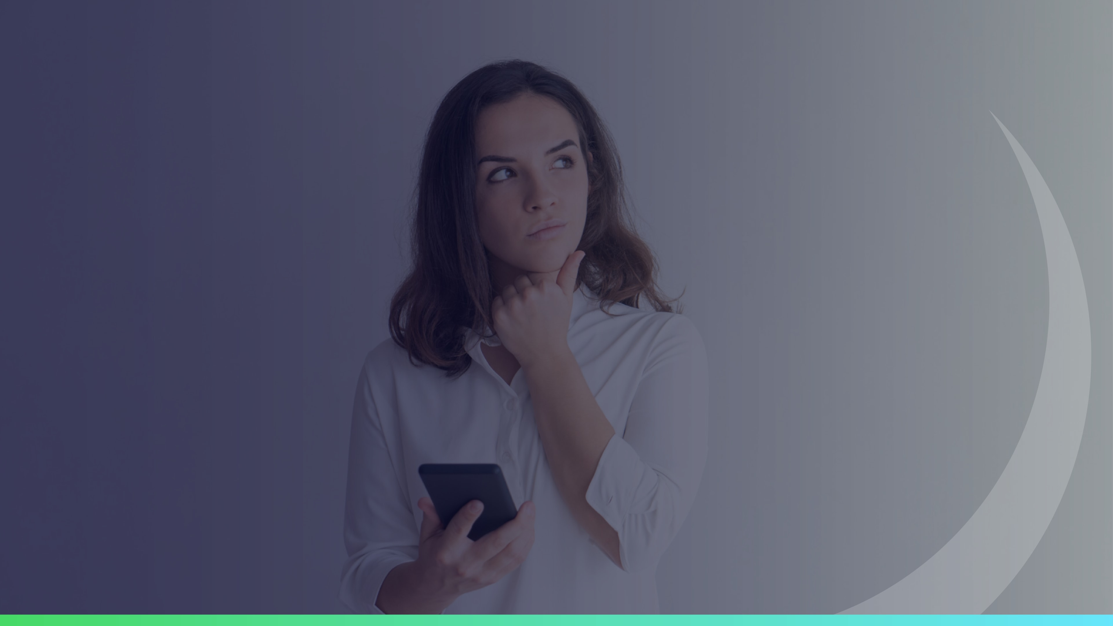 Woman holding a smartphone and looking up thoughtfully with her hand on her chin against a neutral background.