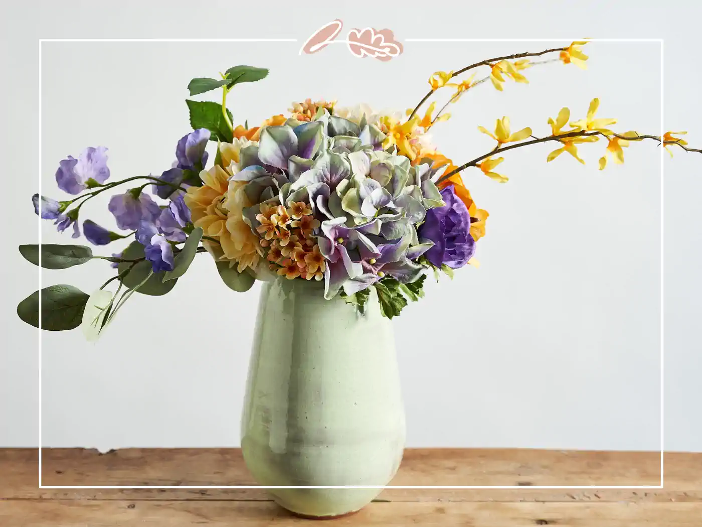 Stunning artificial floral arrangement, plastic flowers pastel colours in a green vase - Fabulous Flowers and Gifts.