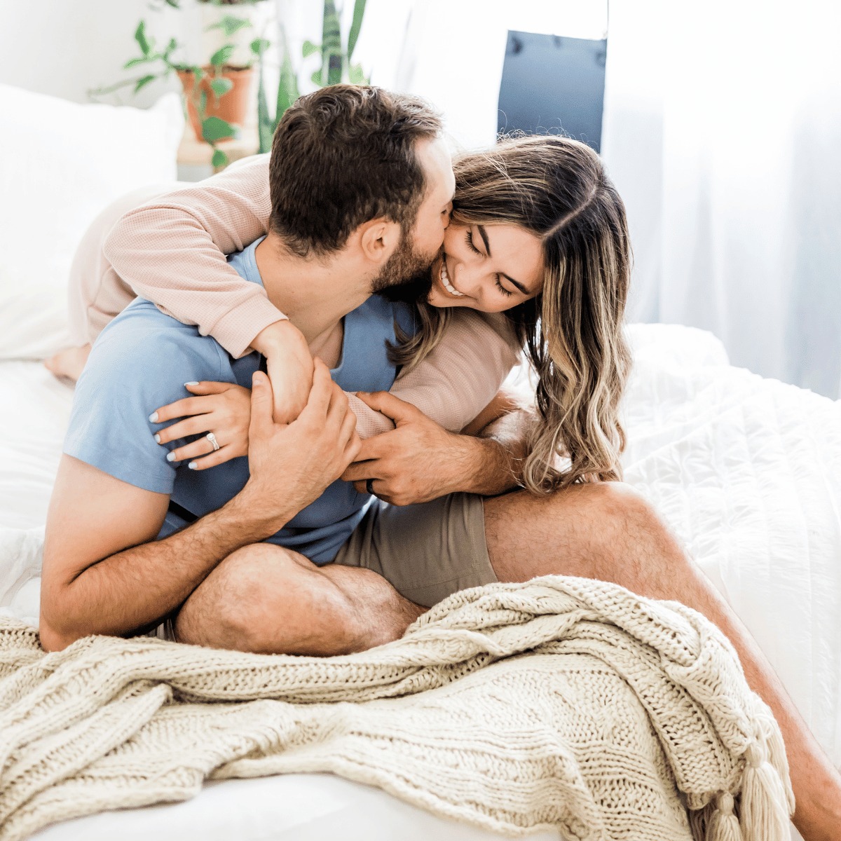 Couple cuddling in bed showing physical intimacy - Featured In: Situationship Vs Friends With Benefits