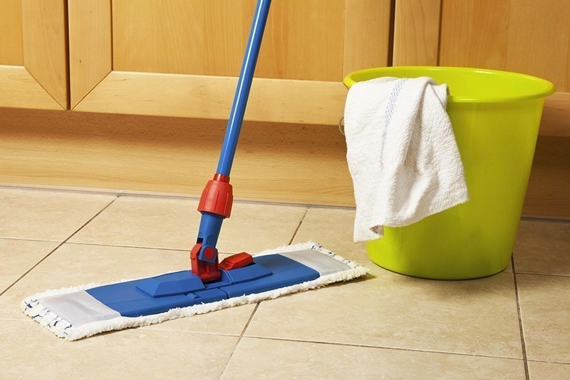 Scrub gently using a damp mop dipped in a warm water with mild detergent