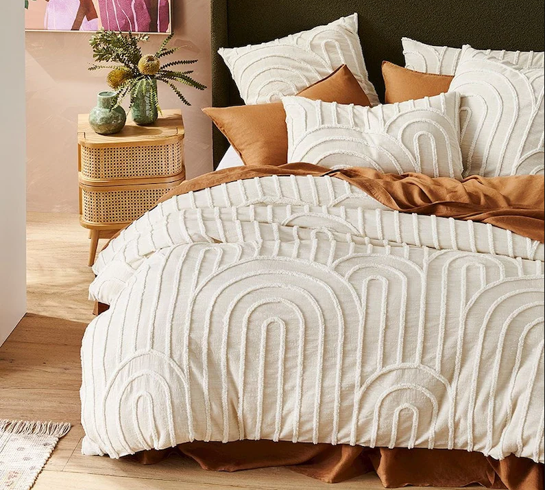 ivory textured bedding with brown sheets and skirt
