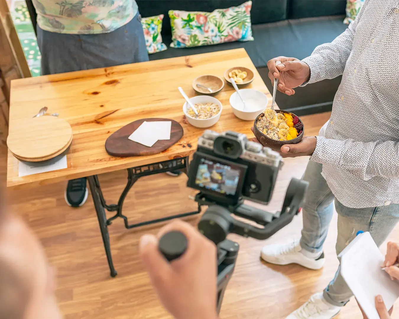 Food influencer filming restaurant dish for social media content