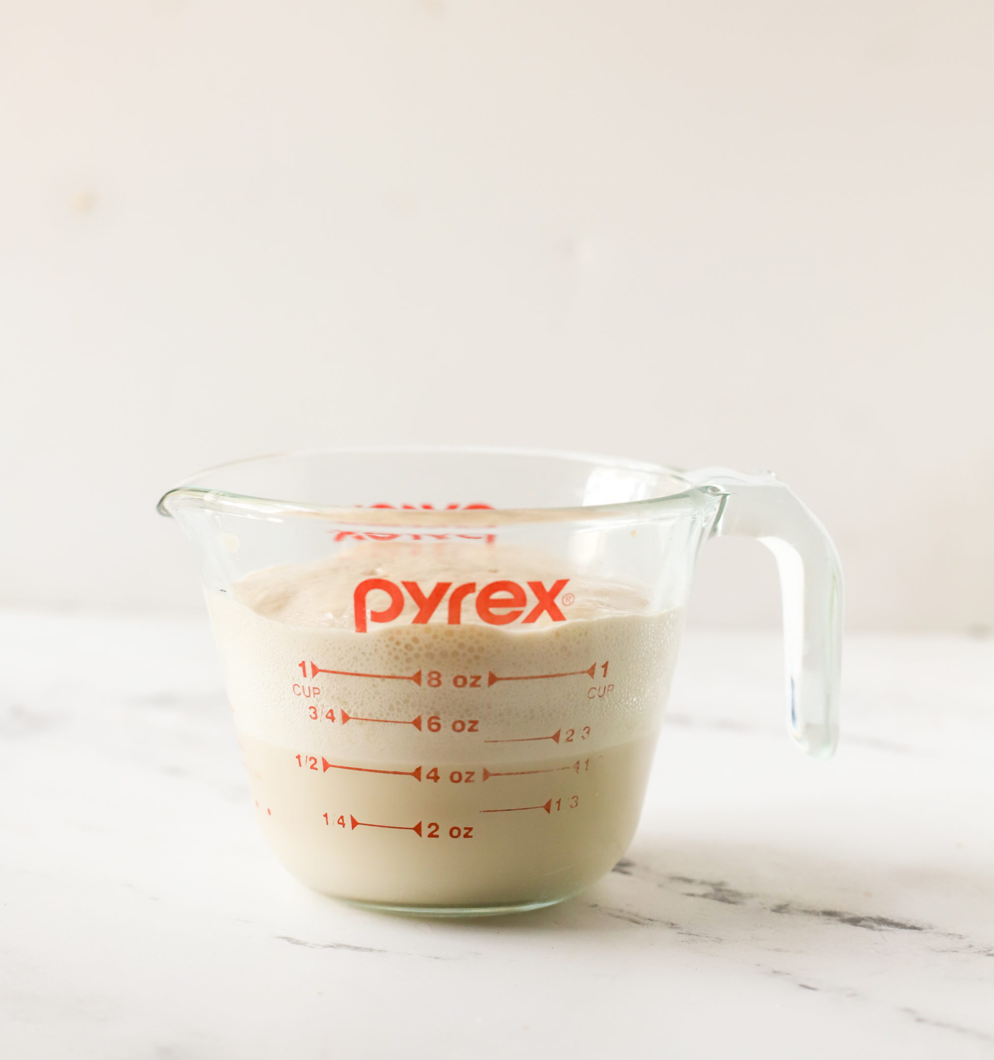measuring cup with proofed active dry yeast