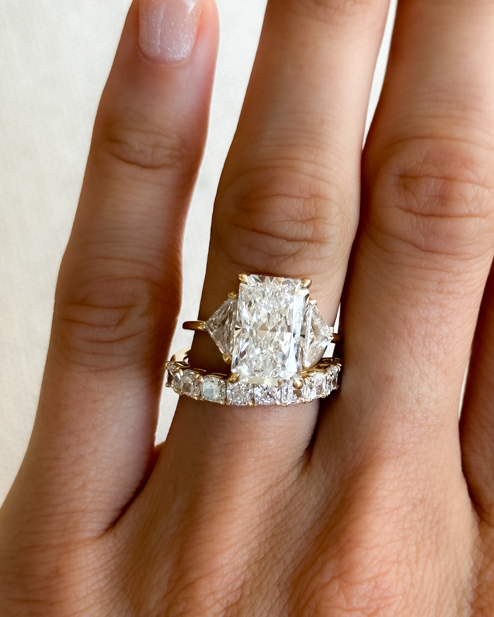 A Three Stone Engagement ring with Shield sides and a 6 carat Radiant Cut diamond