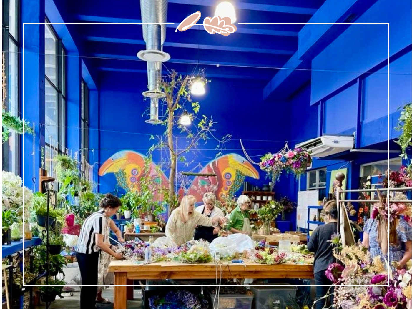 Interior of flower store in the Western Cape, bustling with florists creating beautiful arrangements for a function in the open public. Fabulous Flowers and Gifts.