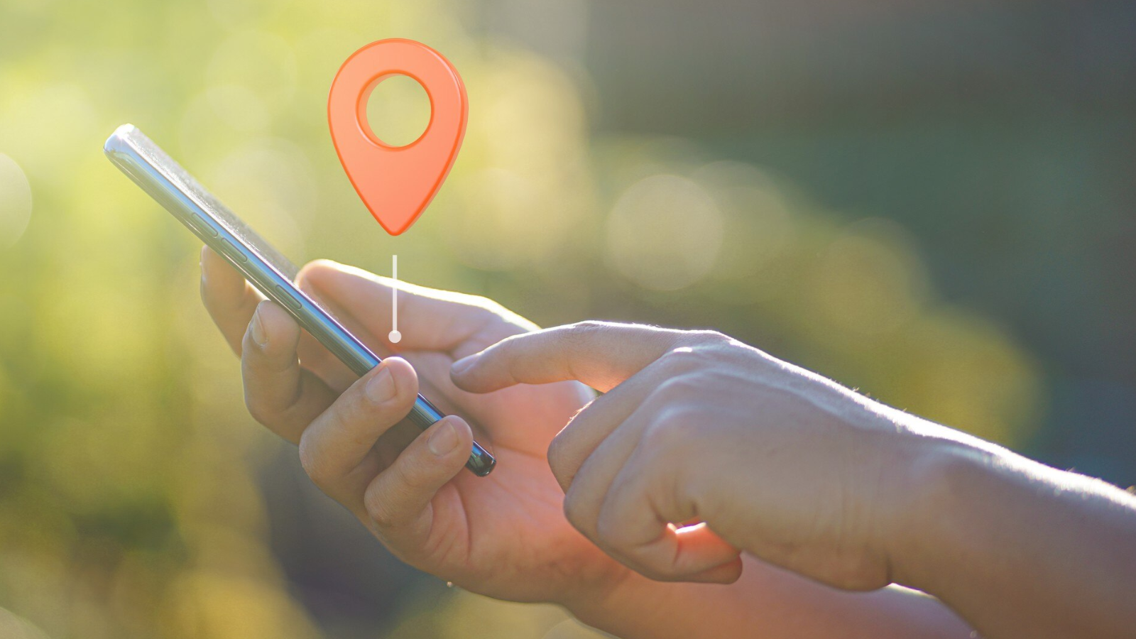 Hand using a smartphone with a location pin overlay, illustrating how if you want optimal communication across different locations, you should start here.