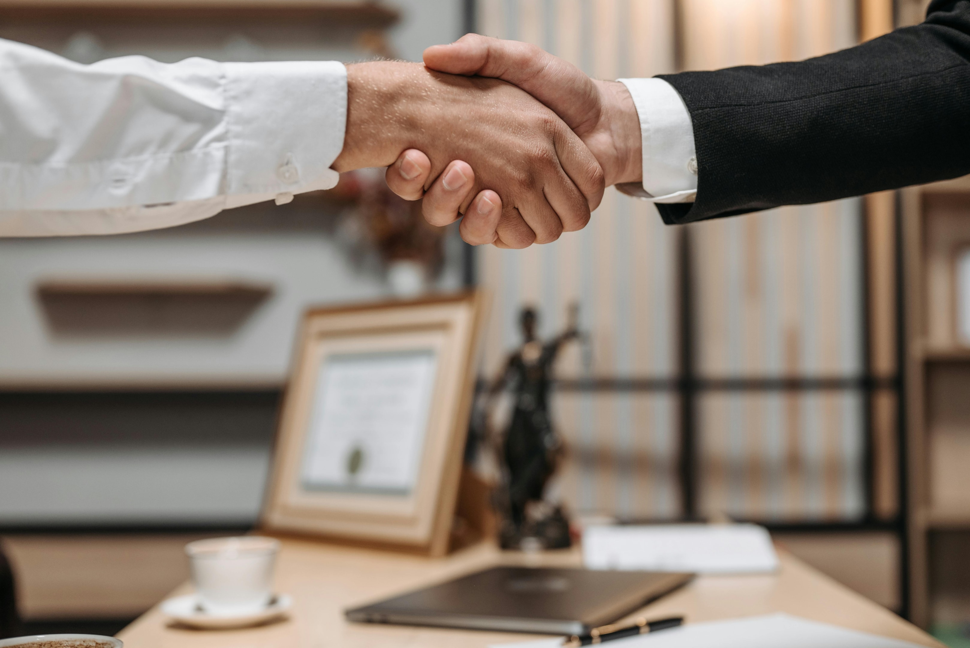 Handshake between attorney and real estate agent. 