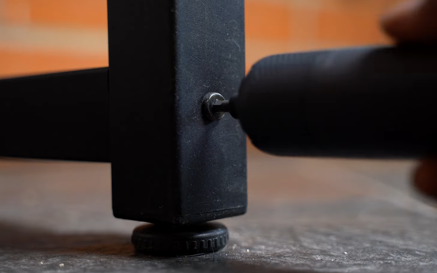removing screw from a table leg