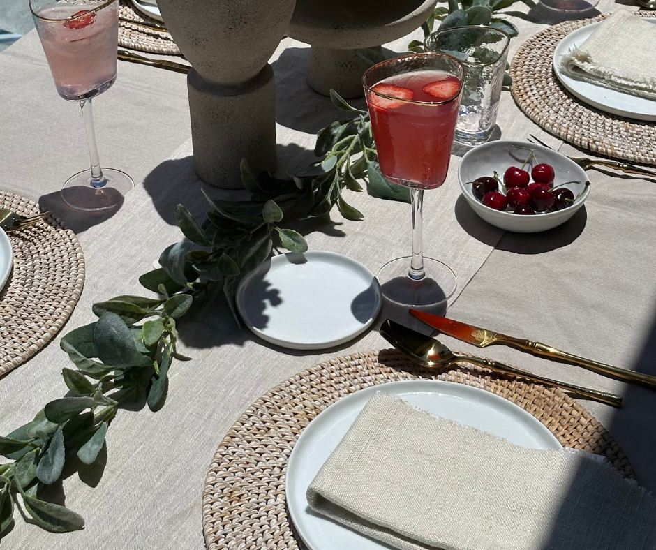 Featured above is the Roma Hammered Wine Glasses, Oro Nero Silverware Set in Gold, the Fel Fringe Linen Napkins., and the Sentiment Vase Collection. 