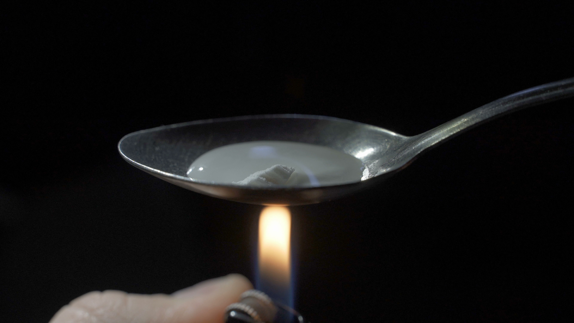 heating up heroin in a spoon