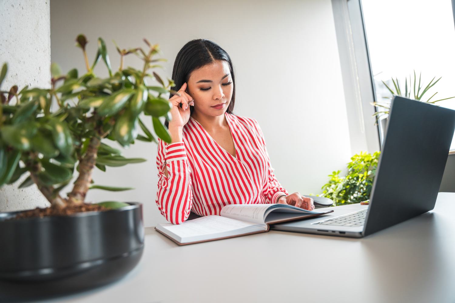 A Filipino remote worker sitting at a desk.