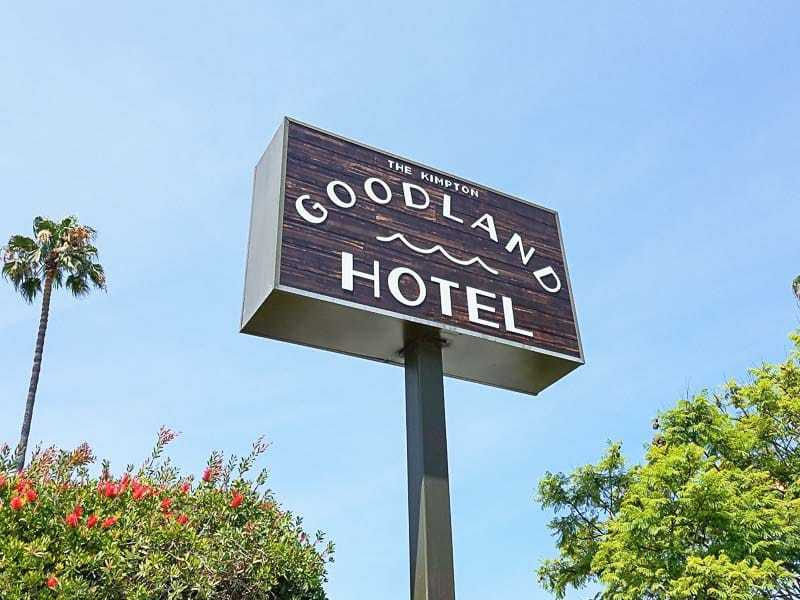 Double sided custom lightbox pole signs like this one for the Goodland Hotel in Goleta, CA tower above surrounding buildings.