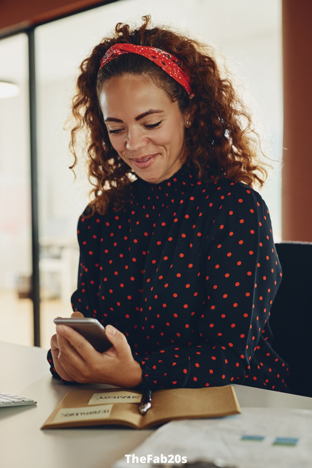 Girl checking phone and smiling to herself