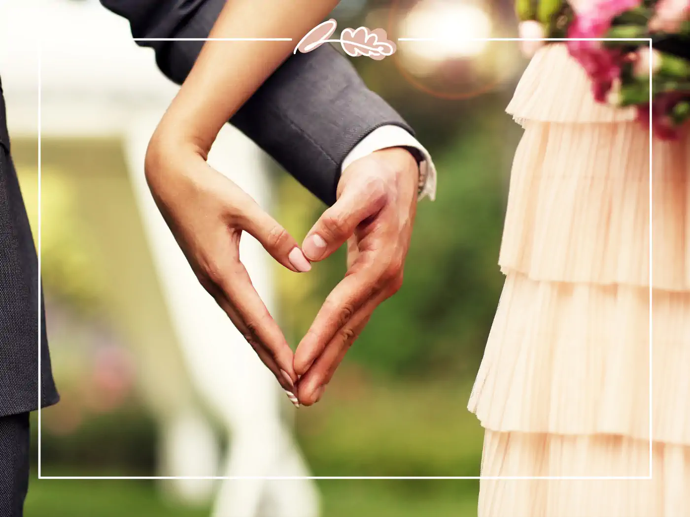 Close-up of a bride and groom forming a heart shape with their hands during their wedding. Fabulous Flowers & Gifts