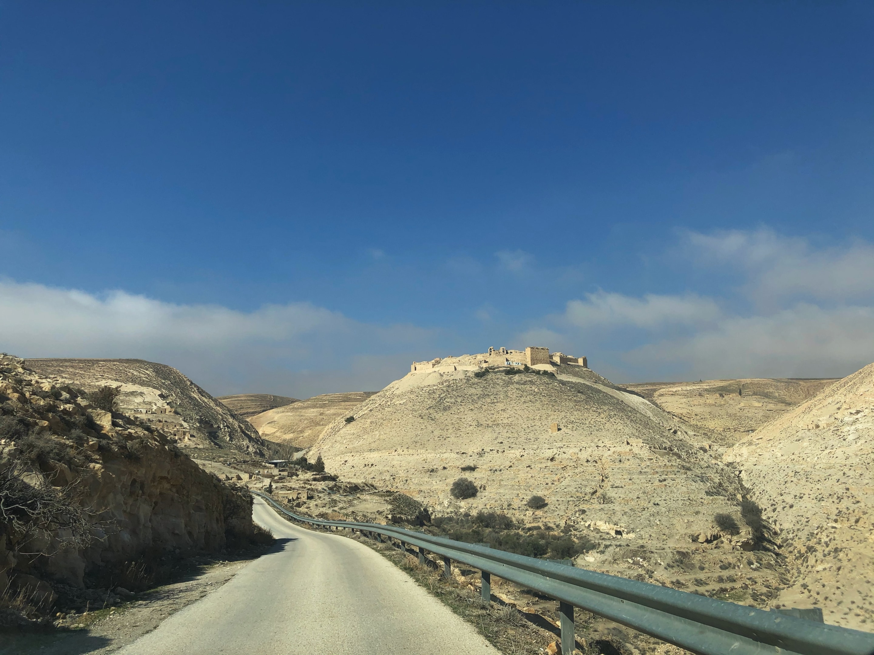 Driving in Jordan with desert landscape