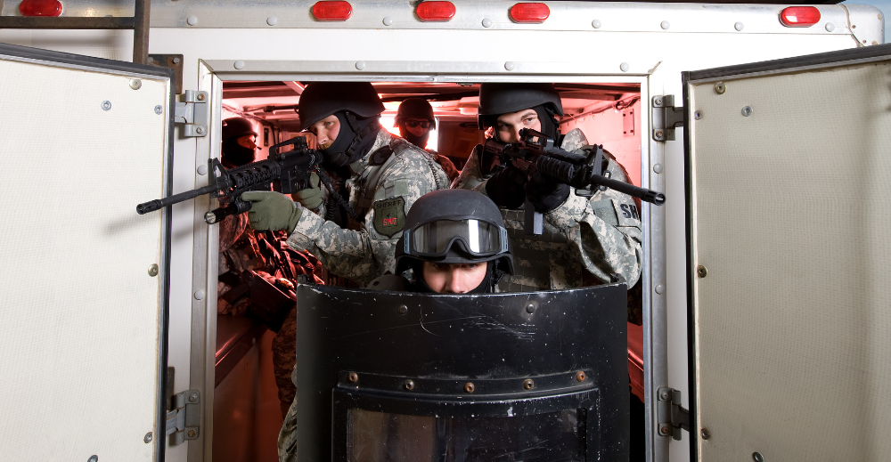 SWAT Team Exiting Transport Vehicle With Riot Gear