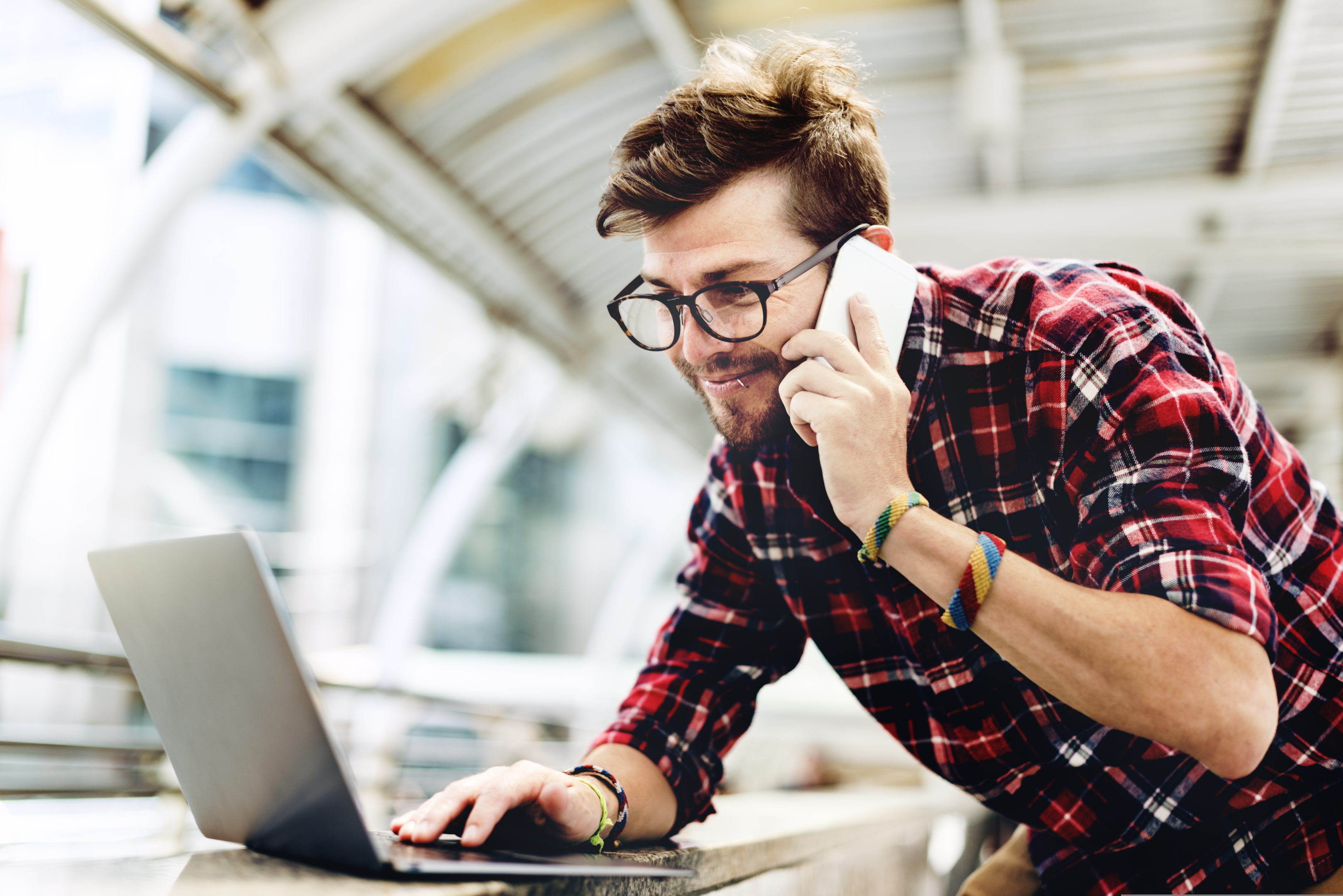 A person using a laptop to strengthen overall security