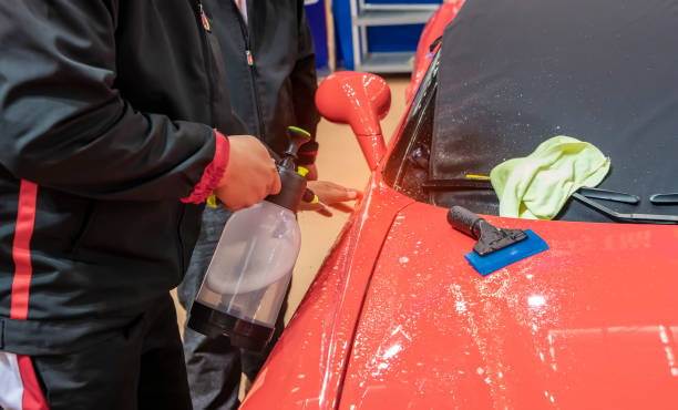 Car being hand-washed with mild soap to maintain the longevity of the Paint Protection Film