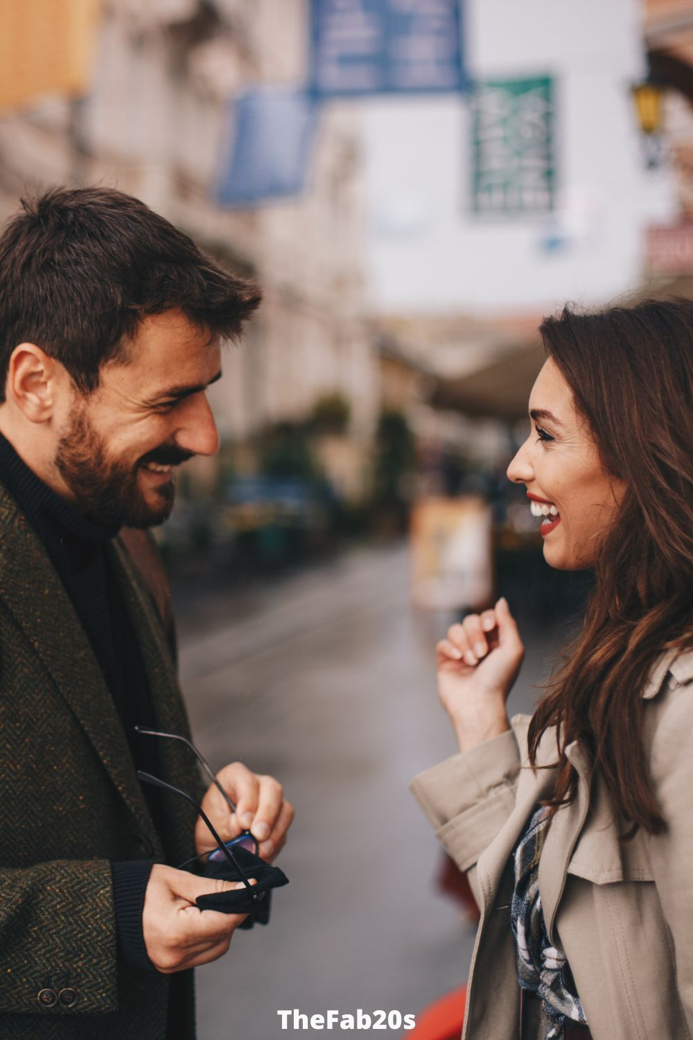 Guuy and girl flirting on the street