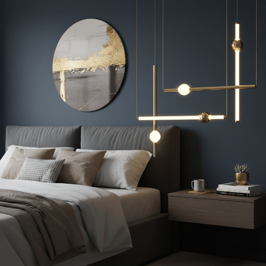 Modern bedroom with gold linear pendant lights above bedside table and upholstered bed.