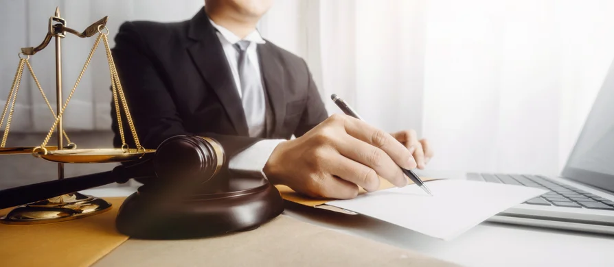 Lawyer signing up a document