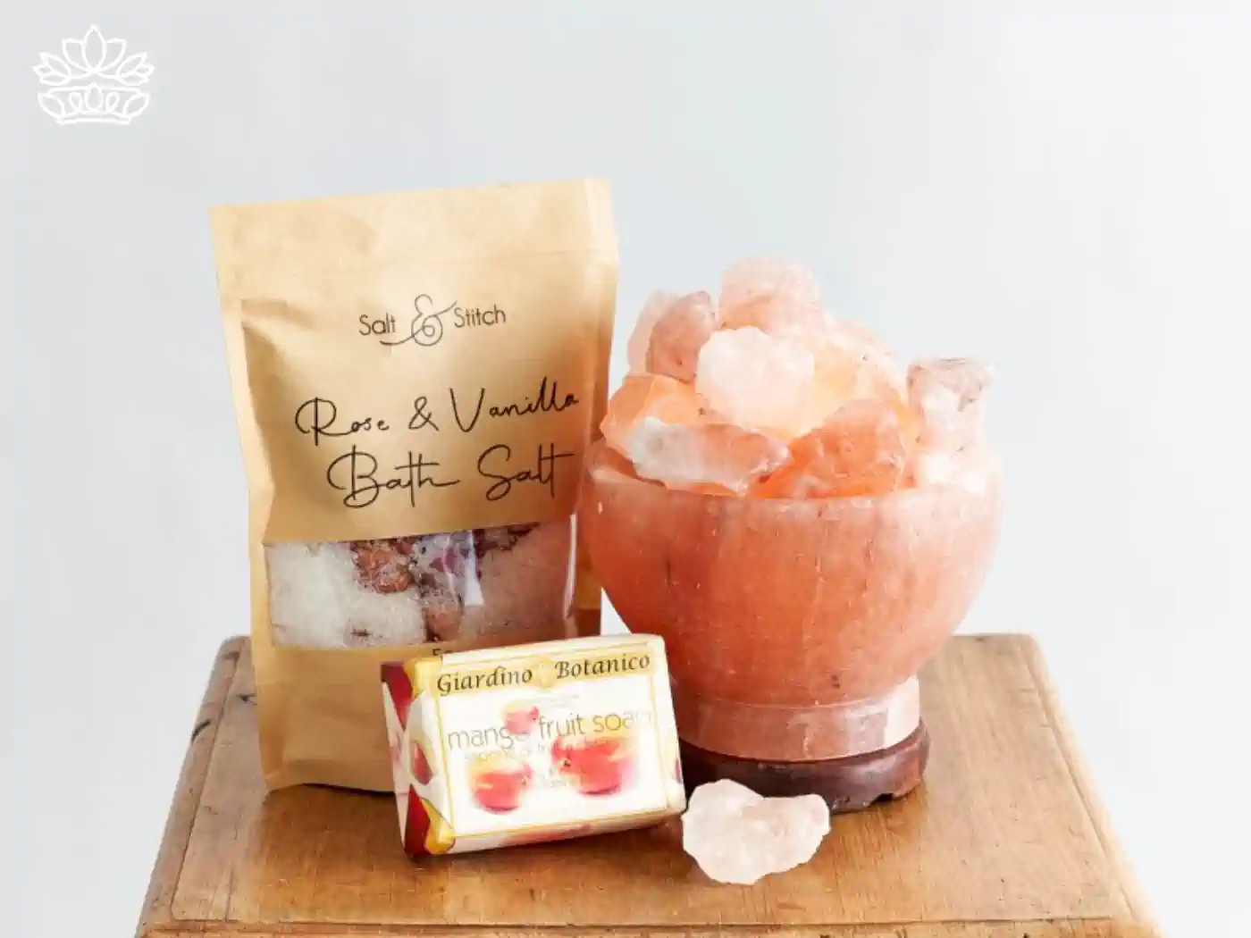 Get well gift box setup featuring Rose & Vanilla bath salt, mango fruit soap, and a Himalayan salt lamp, curated to provide comfort and relaxation. Delivered with Heart. Fabulous Flowers and Gifts.